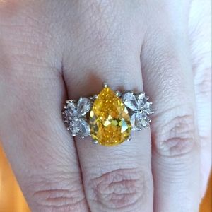 Yellow pear shaped ring with butterflies